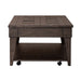 Arrowcreek Lift Top Cocktail Table in Weathered Stone - Furniture 4 Less (Jacksonville, NC)