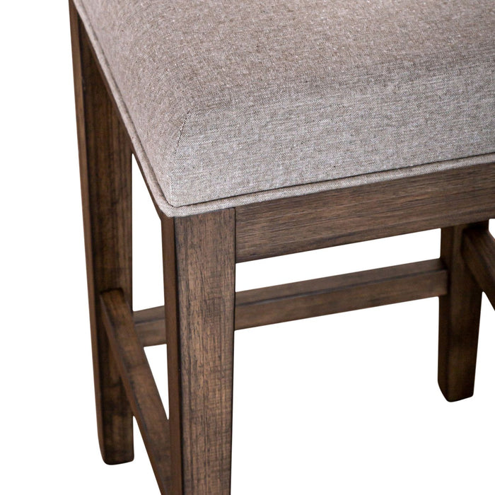Arrowcreek Upholstered Console Stool in Weathered Stone - Furniture 4 Less (Jacksonville, NC)
