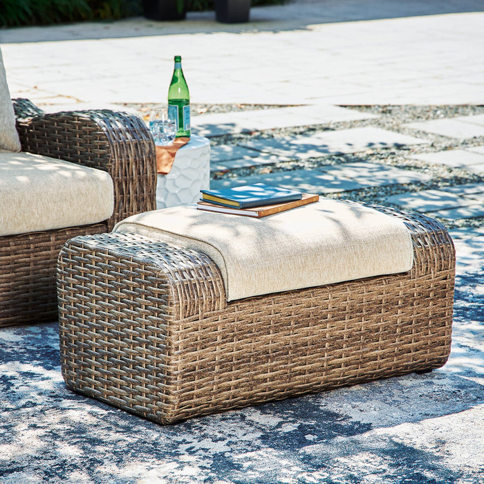 Sandy Bloom Outdoor Ottoman with Cushion - Furniture 4 Less (Jacksonville, NC)